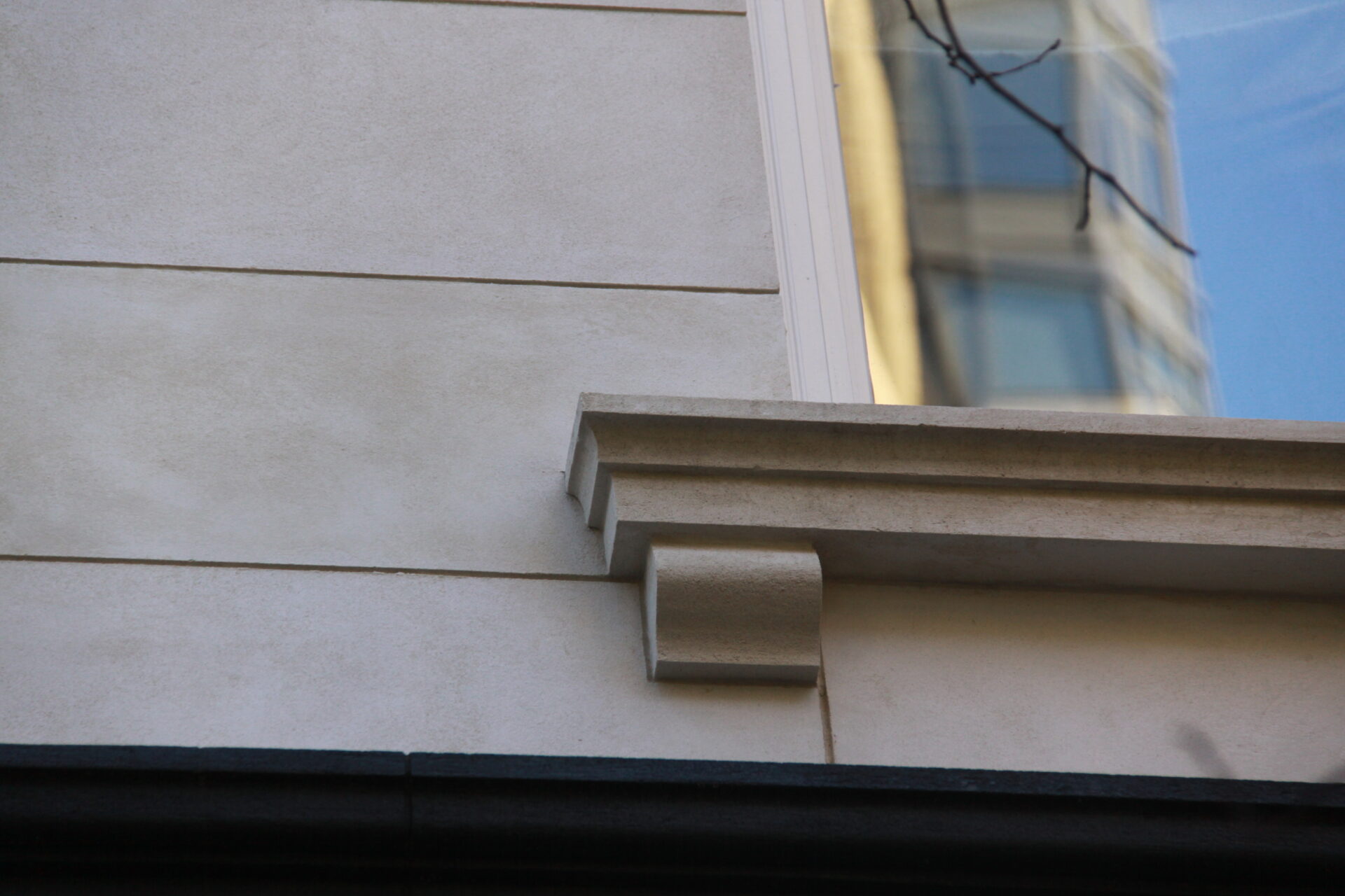 Detail of the Kim Eng Townhouse sill detail and reconstructed stucco wall.