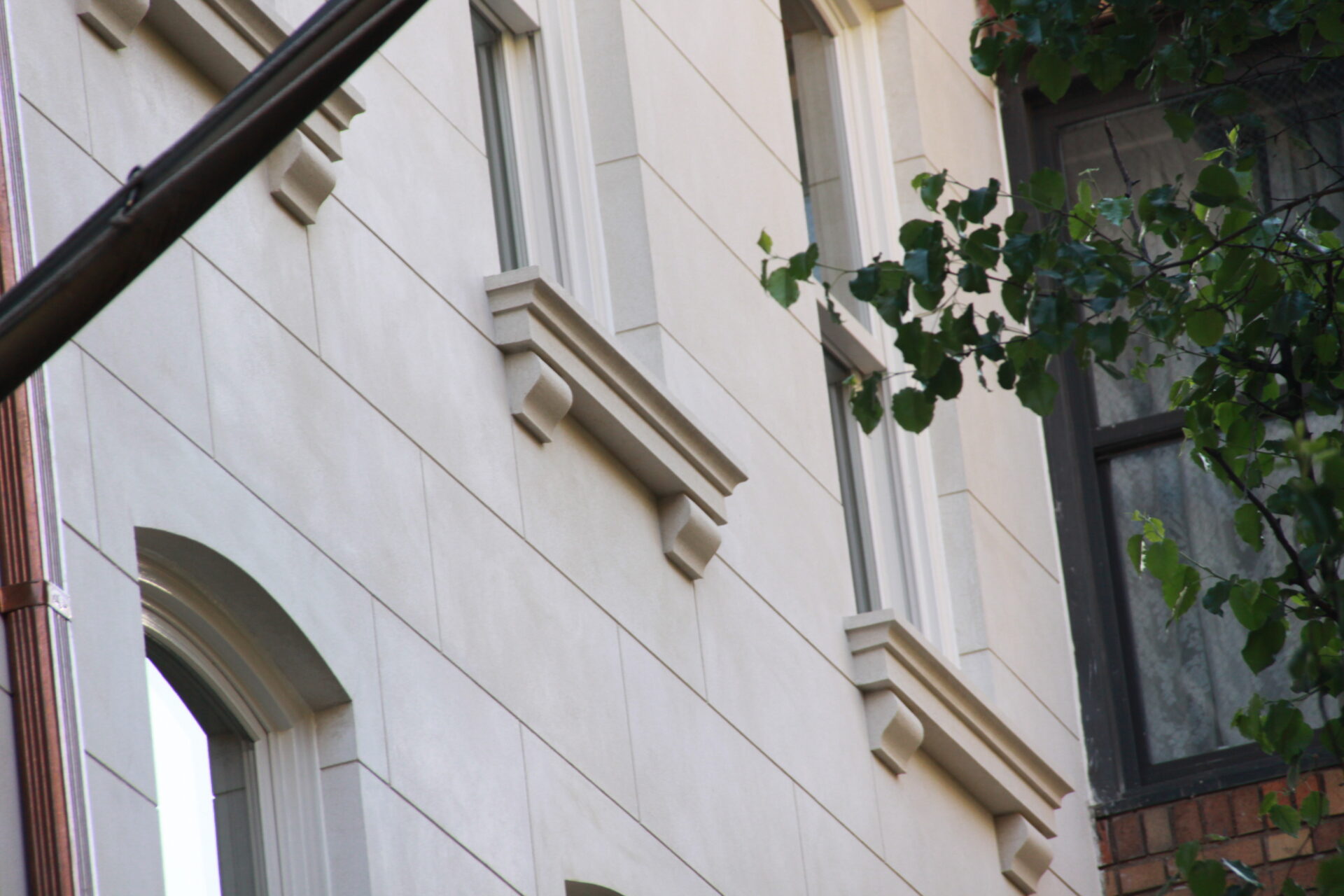 Detail of the Kim Eng Townhouse sill detail and reconstructed stucco wall.