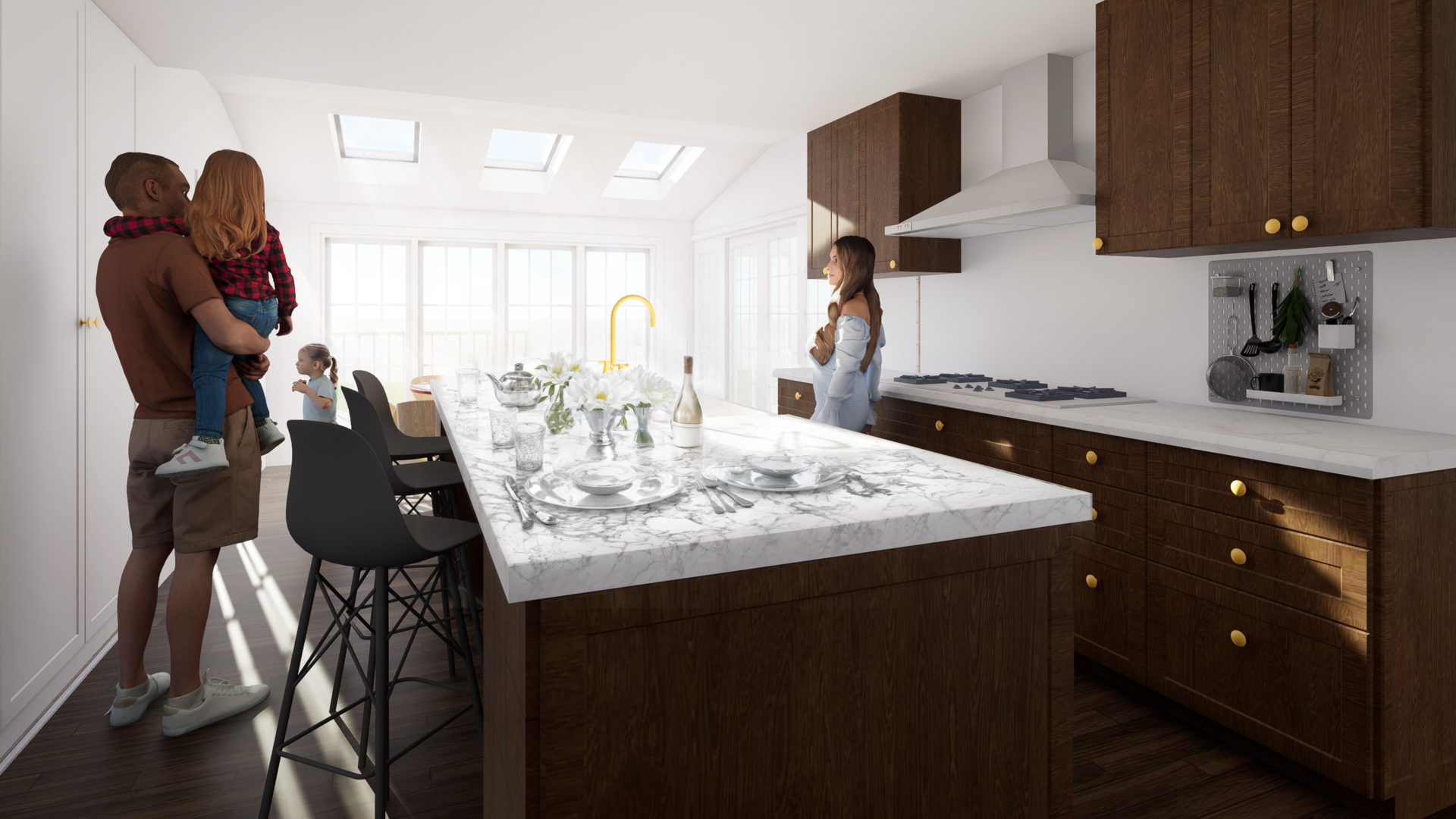 View across the East Williston House kitchen island set for a meal, showing marble counters, wood cabinets with brass pulls, skylights, and a family standing by the windows.”