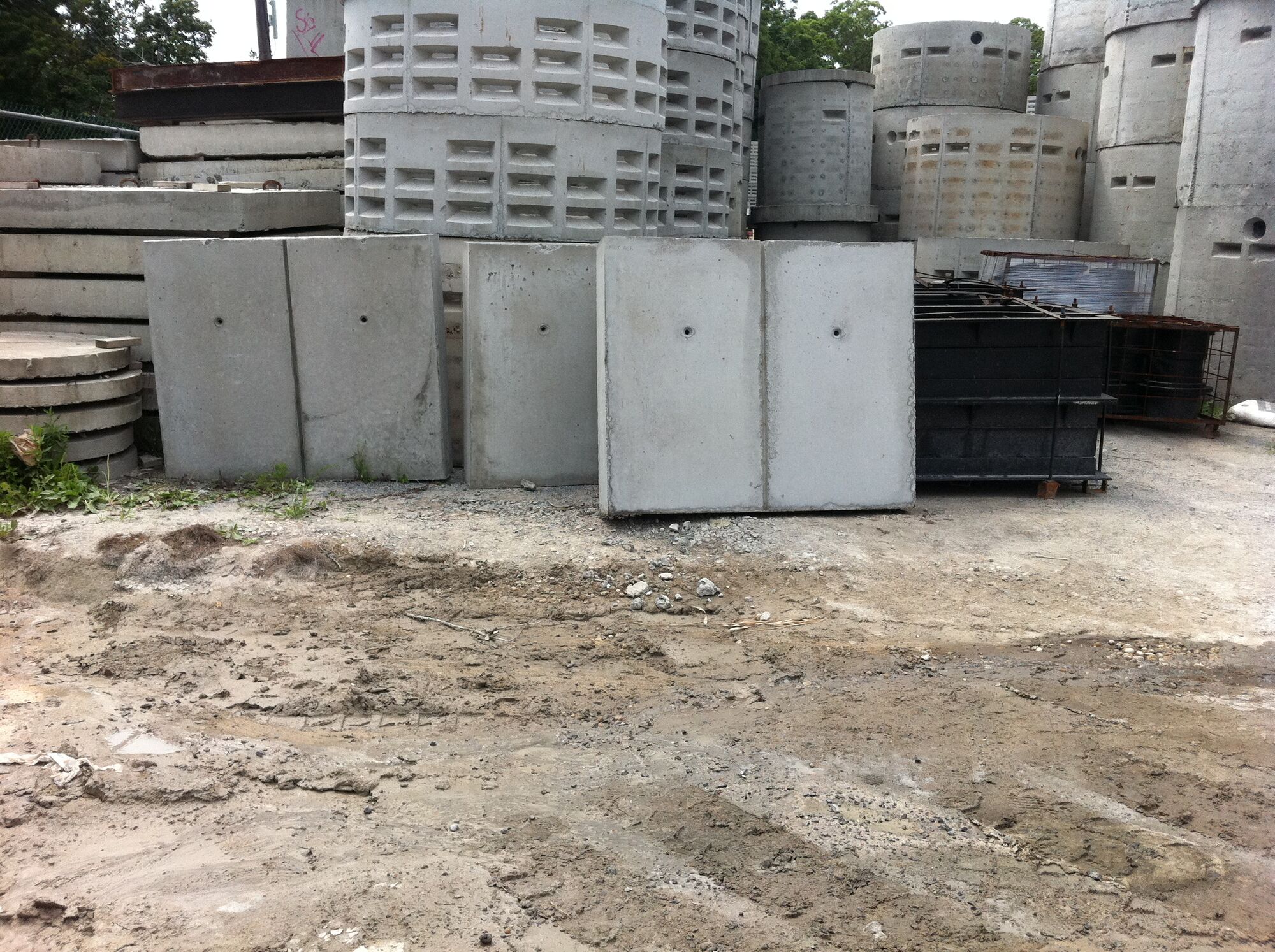 Several concrete sample panels lined up outdoors.